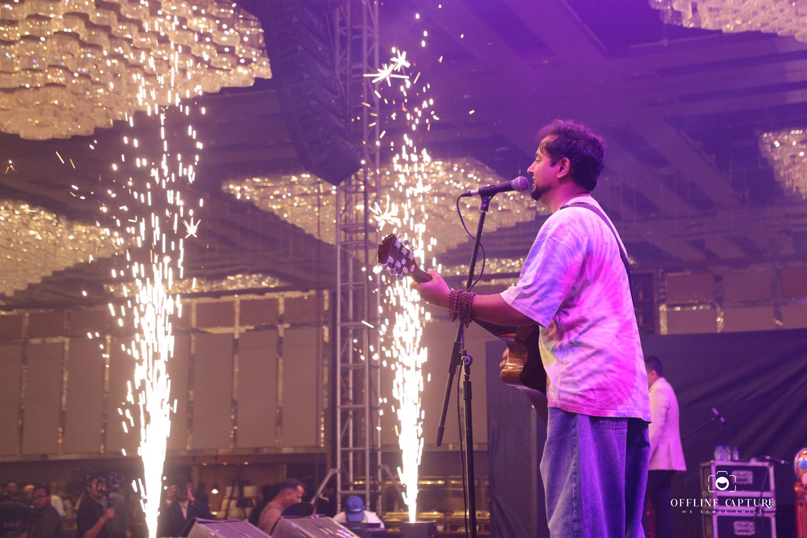 Live singer performing with stage pyrotechnics